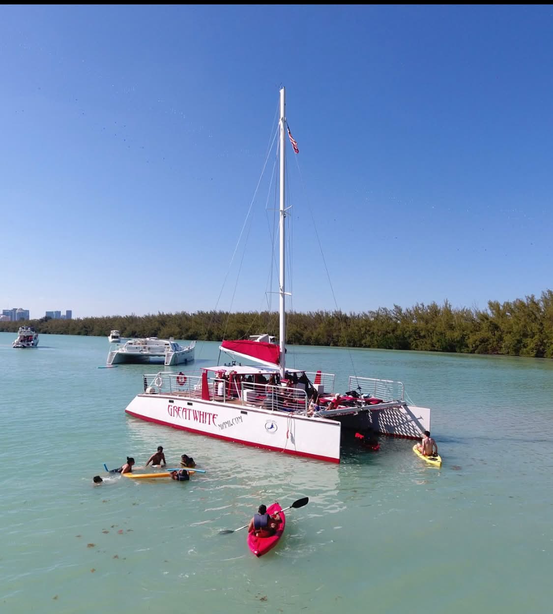 Wedding catamaran anchored on turquoise water at the sandbar